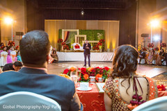 Sweet indian couple listening to wedding speech indian wedding reception,indian groomsmen fashion,indian groomsmen