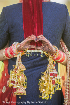 Indian bride showing heart shape with her hands outdoor photography,indian bride,indian groom,indian bridal jewelry