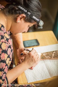 Indian bride getting mehndi art done mehndi artist,pre- wedding celebrations,indian bridal mehndi