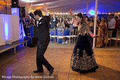 Lovely indian newlyweds dancing indian wedding reception,dj and entertainment,indian bride fashion,indian groom suit