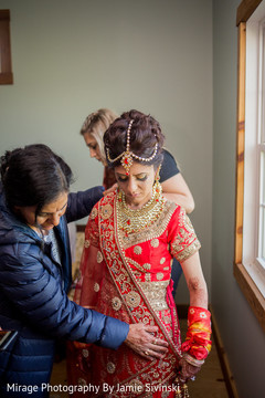 Indian bride's getting ready scene bridal jewelry,indian bride fashion,indian bride getting ready