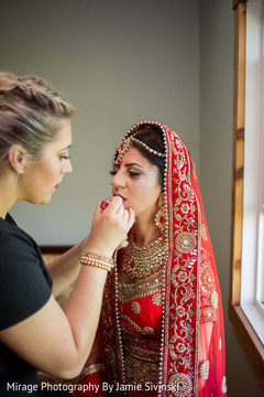 Beautiful indian bride being dolled up for her ceremony bridal jewelry,indian bride fashion,indian bride getting ready,indian bride hair and makeup