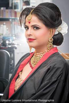Beautiful indian bride being dolled up for her ceremony Beautiful indian bride being dolled up for her ceremony