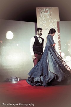 Indian bride and groom performing during sangeet night Indian bride and groom performing during sangeet night