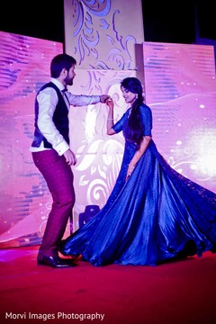 Lovely indian bride and groom dancing during sangeet pre- wedding celebrations,sangeet,dj and entertainment,indian bride and groom