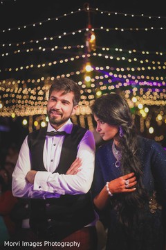 Adorable indian bride and groom during sangeet Adorable indian bride and groom during sangeet