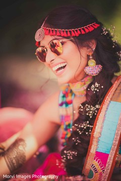 Stunning indian bride laughing mehndi party,pre- wedding celebrations,indian bride fashion