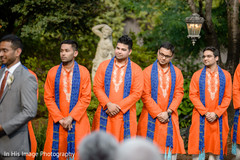 Indian groomsmen in traditional orange sherwanis. indian fusion wedding ceremony,indian groomsmen,sherwani