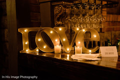 Romantic marquee LOVE letters. floral and decor,lighted wedding letters,indian wedding photography