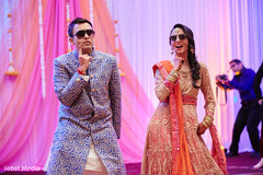 Bride and groom dancing during sangeet Bride and groom dancing during sangeet