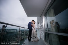Sweet indian couple kissing indian bride fashion,indian groom fashion,outdoor photography
