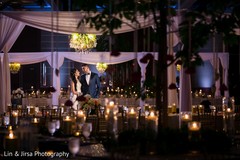 Adorable indian bride and groom posing indian wedding reception,indian wedding reception floral and decor,indian wedding planning and design,indian bride and groom