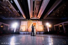 Magical indian couple having their first dance indian wedding reception,indian bride fashion,indian groom suit,dj and entertainment