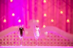 Customized champagne glasses. indian wedding reception,floral and decor,planning and design