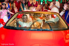 Amazing shot of Indian newlyweds exiting. indian bride and groom,transportation,post ceremony traditions