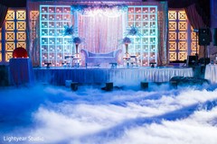 Fascinating Indian wedding reception uplightning and fog. floral and decor,wedding reception,lightning