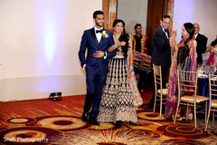 Happy newlyweds entering the wedding reception. Happy newlyweds entering the wedding reception.