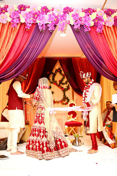 Bride and groom surrounding the fire. indian wedding ceremony,floral and decor,mandap