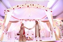 Lovely indian couple posing under mandap indian wedding ceremony,indian bride fashion,indian groom fashion,mandap