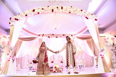 Adorable indian couple holding hands indian wedding ceremony,indian bride fashion,indian groom fashion,mandap