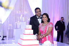 Indian wedding reception cutting the cake moment indian bride fashion,indian wedding reception,indian groom fashion,wedding cake