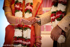 Indian bride and groom holding hands close-up Indian bride and groom holding hands close-up