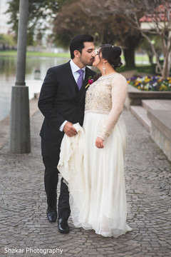 Sweet indian couple kissing indian groom fashion,indian bride fashion,outdoor photography