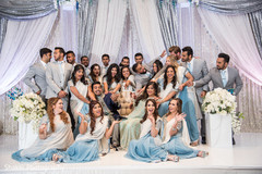 Vibrant indian wedding reception portrait indian bride and groom,indian wedding reception,indian bridesmaids and groomsmen,indian wedding reception floral and decor