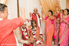 Indian bride and groom being showered with rose petals indian wedding ceremony,indian bride fashion,indian groom fashion
