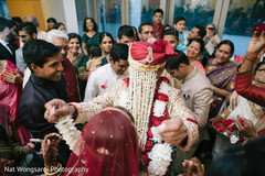 Indian bride and groom's garland exchange during milni indian wedding ceremony,milni ceremony,indian groom