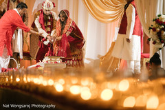 Adorable indian couple making offerings to sacred fire indian wedding ceremony,indian bride and groom,indian wedding ceremony photography