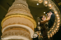 Marvelous indian couple with cake photo shoot indian wedding reception,indian wedding cake,indian wedding cake design