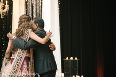 See this lovely indian bride and groom group hug indian wedding reception,indian bride and groom,indian wedding reception photography