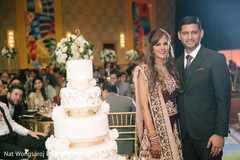 Mind blowing indian bride and groom's wedding cake indian wedding reception,indian bride and groom,indian wedding reception photography