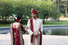 Sweet indian bride and groom's first look capture first look photography,indian bride fashion,indian bridal bouquet,indian groom