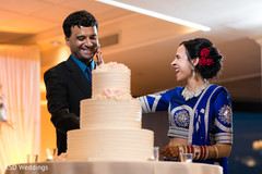 Indian wedding reception cutting the cake moment indian wedding reception,indian bride and groom,indian bridal bangles,indian wedding cake