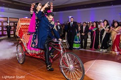 Indian couple entering in a rickshaw. indian bride and groom,indian wedding reception,rickshaw