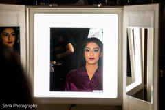 Sweet indian bride getting make up done Sweet indian bride getting make up done
