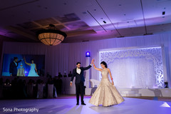 Indian newlyweds having their first dance indian wedding reception,indian bride and groom,lightning,first dance