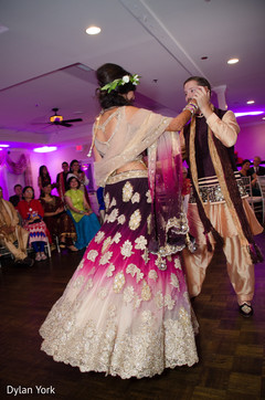 Indian bride and groom to be dancing at their sangeet. Indian bride and groom to be dancing at their sangeet.