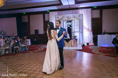 Delightful indian couple having their first dance indian wedding reception,indian wedding reception photography,indian bride and groom,first dance