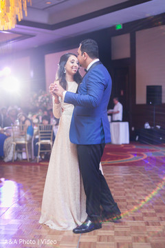 Indian newlyweds having their first dance indian wedding reception,indian wedding reception photography,indian bride and groom,first dance
