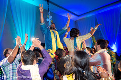 Indian bride and groom being lifted up pre- wedding celebrations,sangeet,indian bride and groom