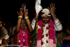 Indian bride throws rice behind her without looking back indian wedding ceremony,indian wedding ceremony photography,indian bride and groom