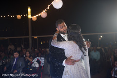 Indian newlyweds having their first dance indian wedding reception,indian bride and groom,first dance