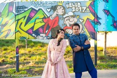 Indian bride and groom having a joyful moment indian bride and groom,indian groom fashion,indian bride fashion,outdoor photography