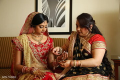 Indian bride getting ready scene. indian bridal makeup,bridal jewelry,getting ready,bridal fashion