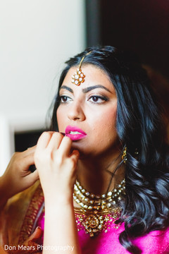 Indian bride getting her makeup done indian bridal makeup,makeup artist,getting ready