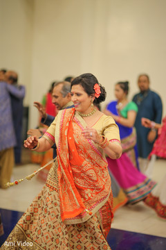 Sangeet party sangeet,orange lengha,pre wedding celebrations