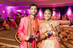 Indian bride and groom with dandiya Sticks. Indian bride and groom with dandiya Sticks.